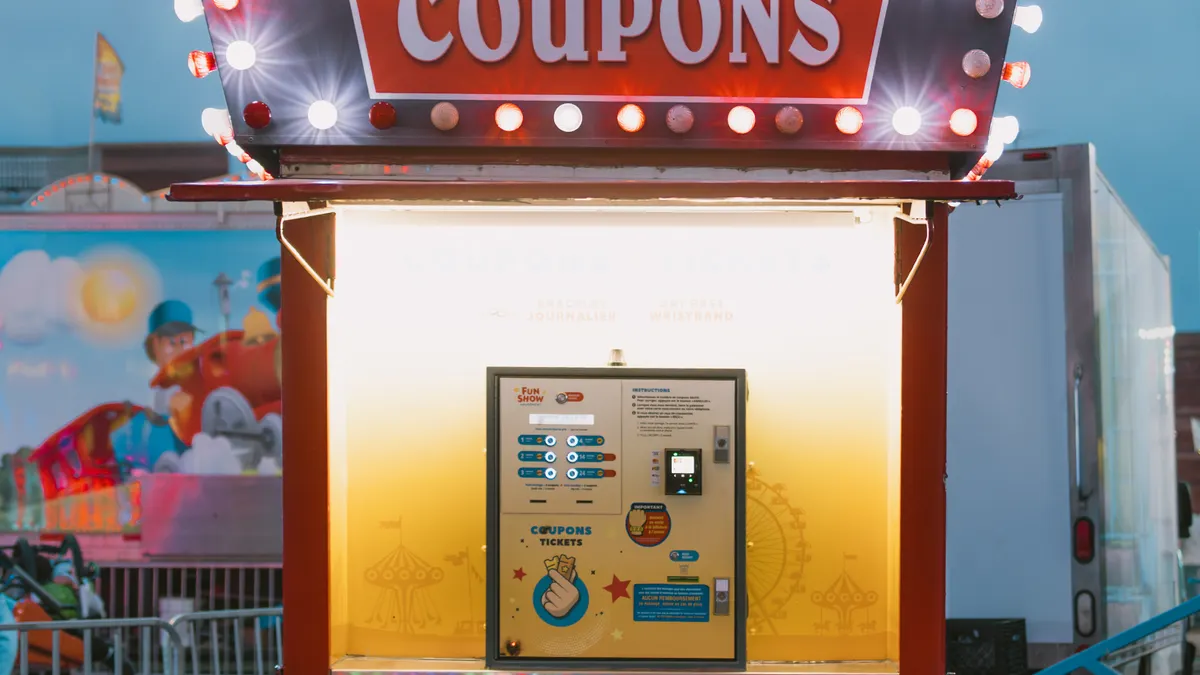Agency vs solo: which SEO tool license and plan should your team buy? — Illuminated Coupon Booth at the Fun Fair